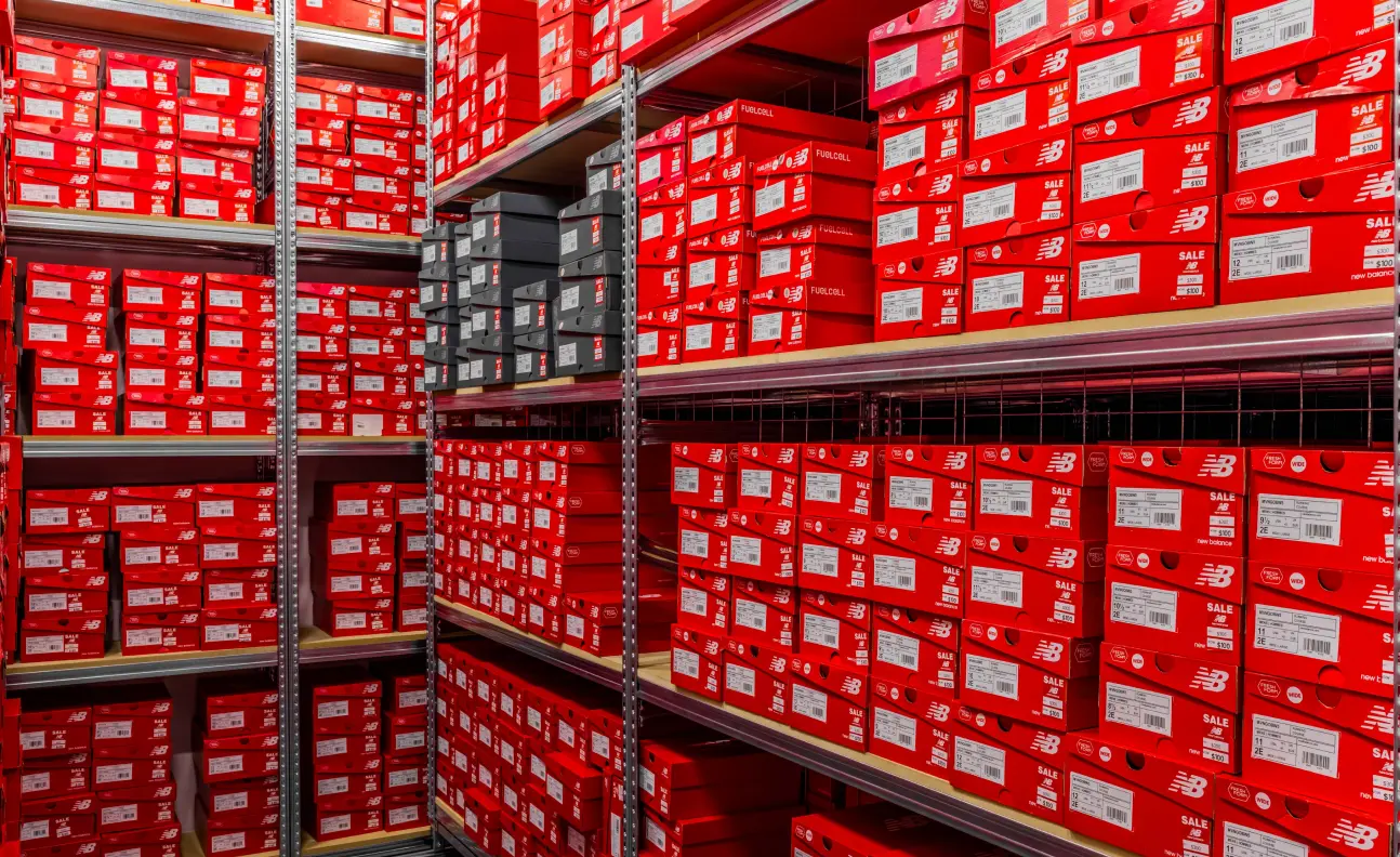 Retail shelving system designed for clear product visibility and organised footwear storage